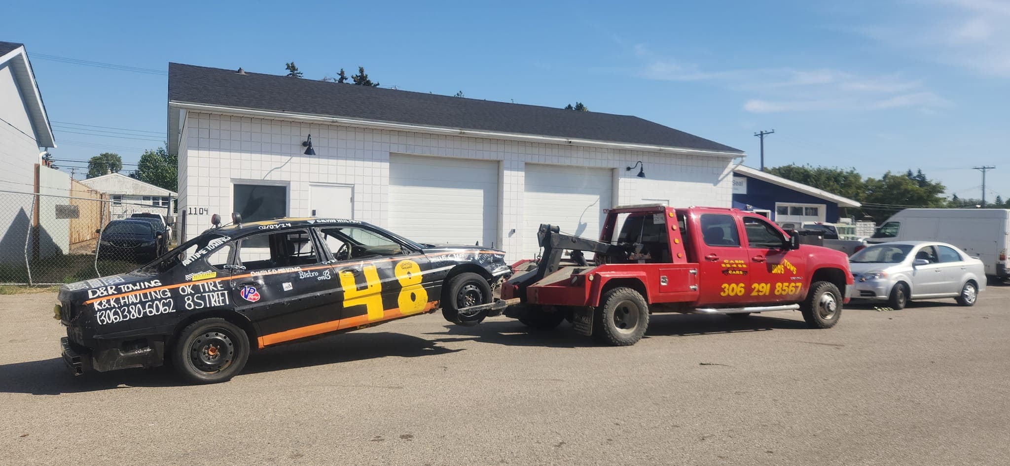 Bro's Tows truck towing a vehicle at the yard